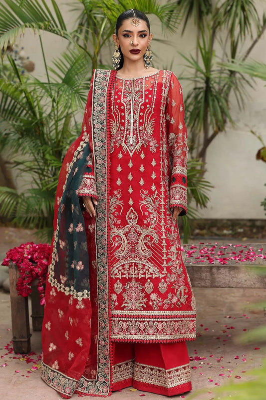 Woman wearing a red embroidered traditional outfit with a floral background