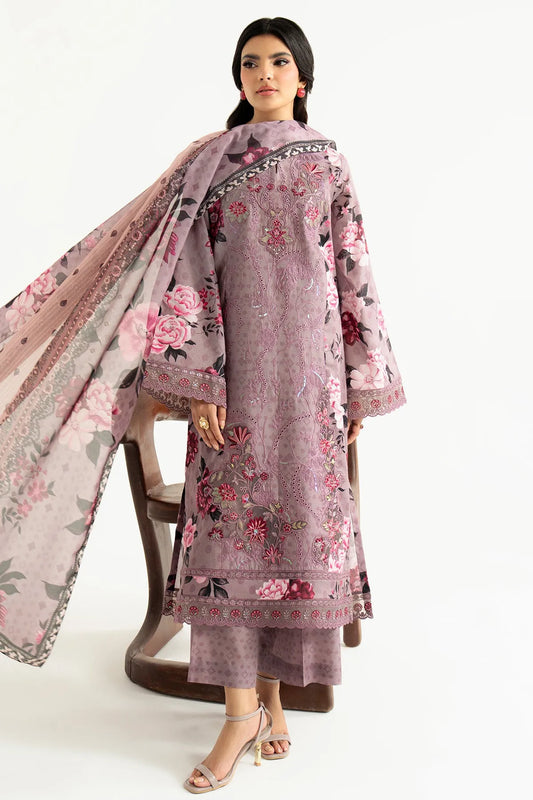 Woman wearing a floral embroidered outfit with a matching dupatta on a white background