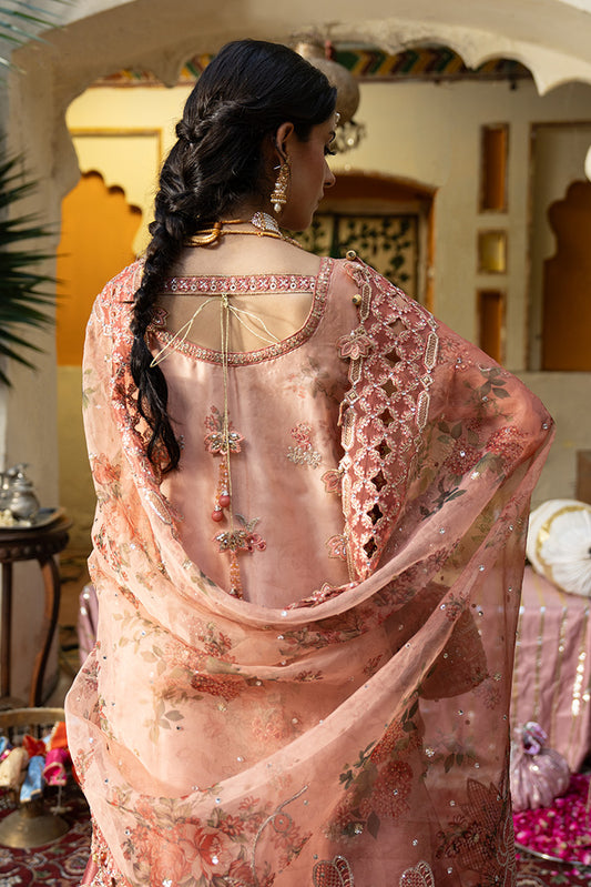 Back view of a peach pink Nikkah dress with intricate embroidery, embellished dupatta and detailed bridal lehenga.
